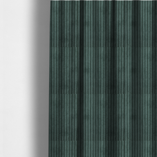 The fabric used to create these made-to-measure curtains is a teal-green corduroy featuring a consistent vertical ribbed texture.
