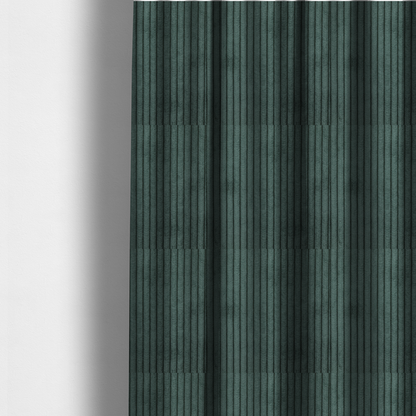 The fabric used to create these made-to-measure curtains is a teal-green corduroy featuring a consistent vertical ribbed texture.