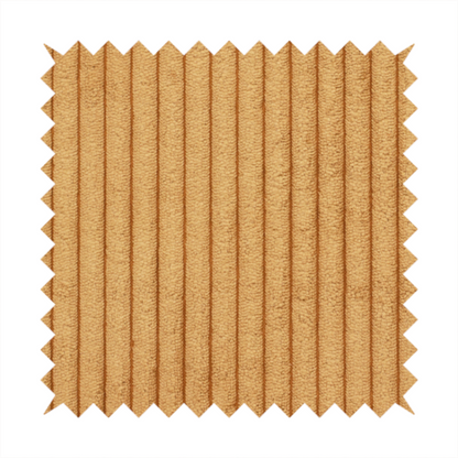 This fabric is a warm, golden-yellow or ochre corduroy featuring a consistent vertical ribbed texture.
