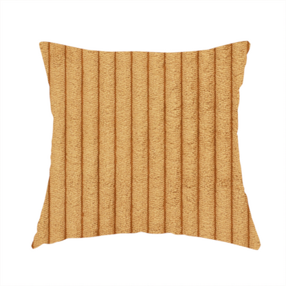 The fabric used to create these handmade cushions  is a warm, golden-yellow or ochre corduroy featuring a consistent vertical ribbed texture.