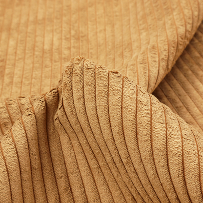 This fabric is a warm, golden-yellow or ochre corduroy featuring a consistent vertical ribbed texture.