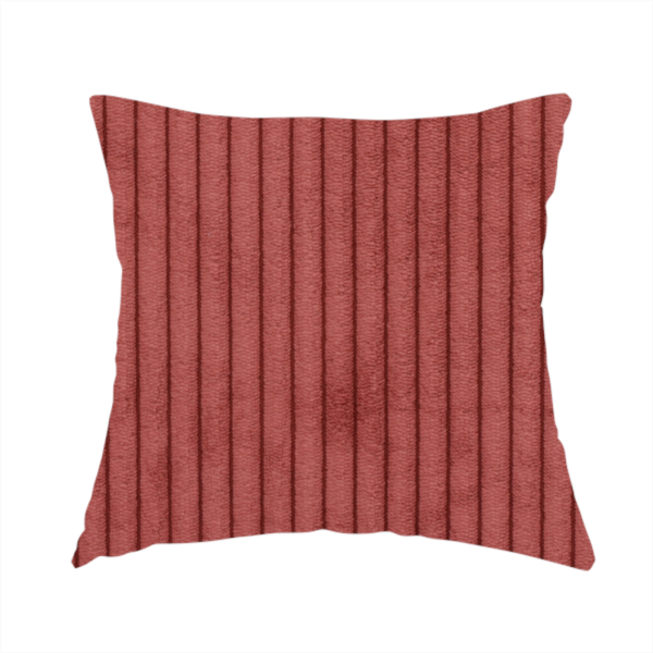 The fabric used to create these handmade cushions is a brick red corduroy featuring a consistent vertical ribbed texture.