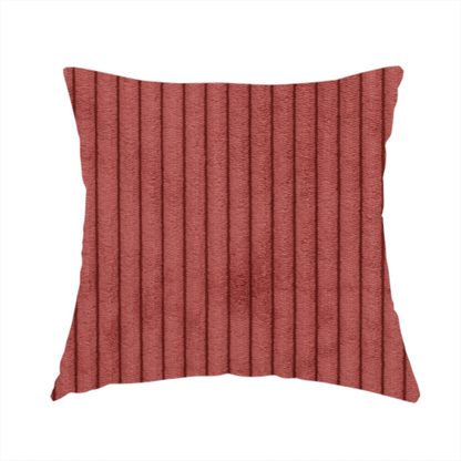 The fabric used to create these handmade cushions is a brick red corduroy featuring a consistent vertical ribbed texture.