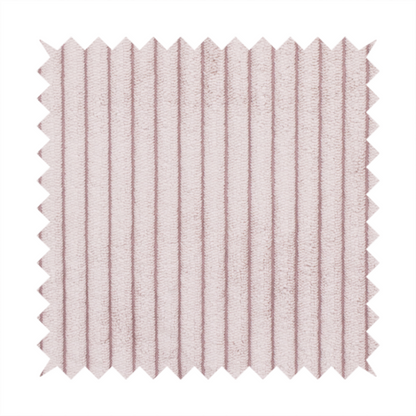 This fabric is a soft, dusty pink or blush-coloured corduroy featuring a consistent vertical ribbed texture.