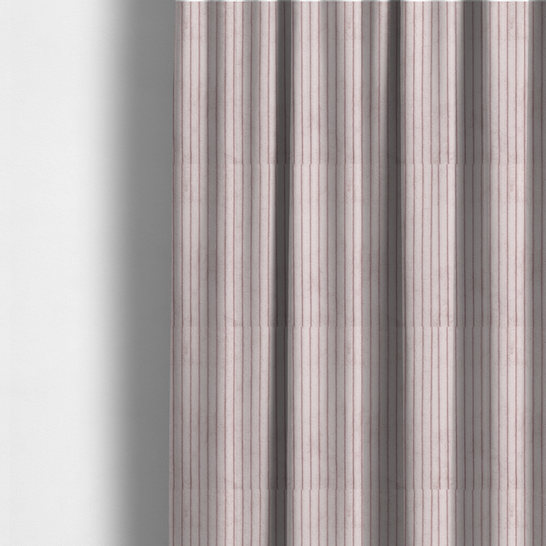 The fabric used to create these made-to-measure curtains is a soft, dusty pink or blush-coloured corduroy featuring a consistent vertical ribbed texture.