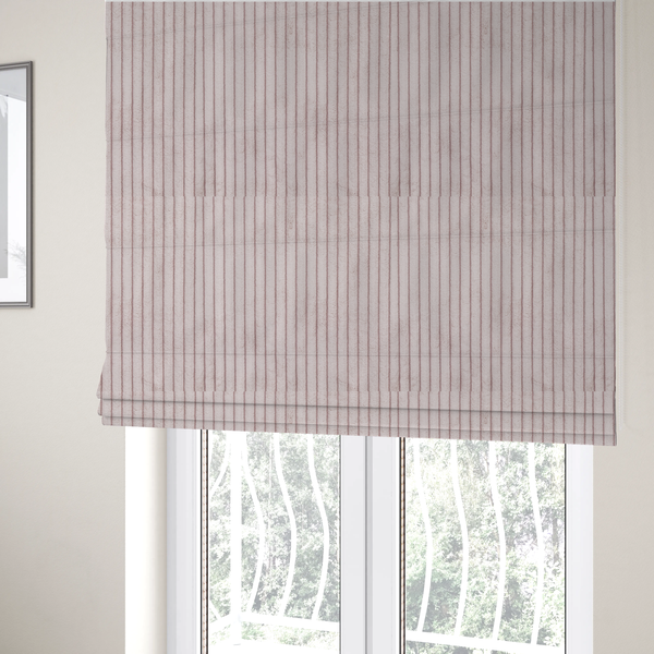 The fabric used to create these Roman blinds is a soft, dusty pink or blush-coloured corduroy featuring a consistent vertical ribbed texture.