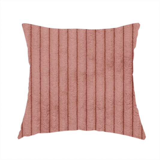 The fabric used to create these handmade cushions is a muted rose or dusty terracotta corduroy featuring a consistent vertical ribbed texture.