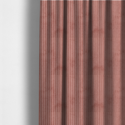 The fabric used to create these made-to-measure curtains is a muted rose or dusty terracotta corduroy featuring a consistent vertical ribbed texture.