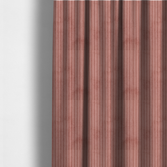 The fabric used to create these made-to-measure curtains is a muted rose or dusty terracotta corduroy featuring a consistent vertical ribbed texture.