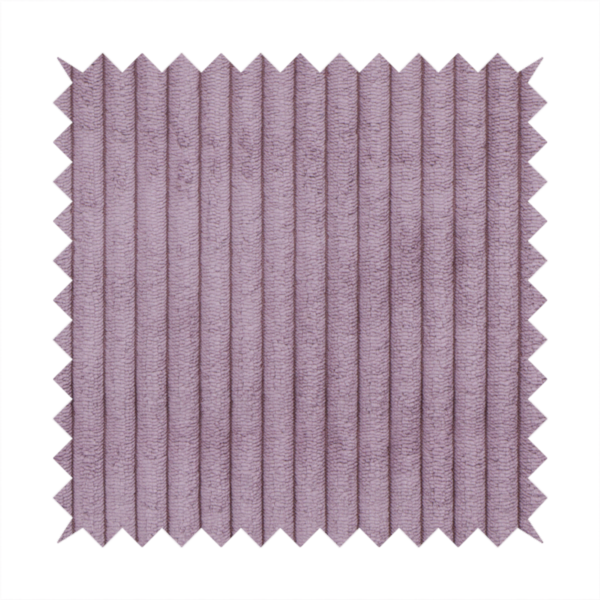 This fabric is a soft, dusty mauve or lavender-toned corduroy featuring a consistent vertical ribbed texture.