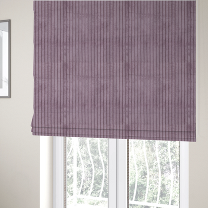 The fabric used to create these Roman blinds is a soft, dusty mauve or lavender-toned corduroy featuring a consistent vertical ribbed texture.