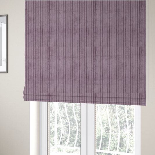The fabric used to create these Roman blinds is a soft, dusty mauve or lavender-toned corduroy featuring a consistent vertical ribbed texture.