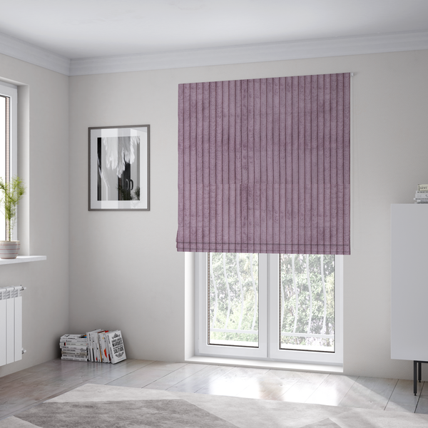 The fabric used to create these Roman blinds is a soft, dusty mauve or lavender-toned corduroy featuring a consistent vertical ribbed texture.