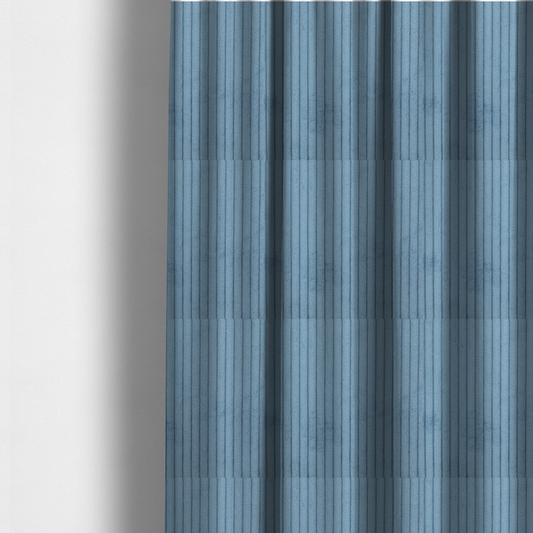 the fabric used to create these made-to-measure curtains is a soft, dusty blue corduroy featuring a consistent vertical ribbed texture.