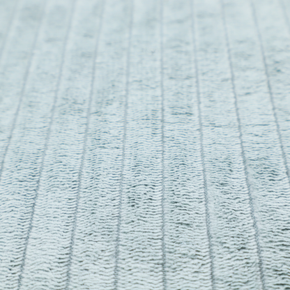 This fabric is a pale, icy blue corduroy featuring a consistent vertical ribbed texture.