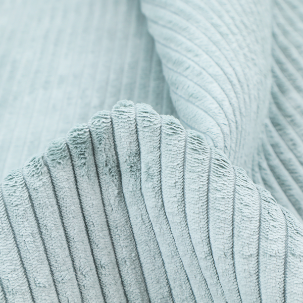 This fabric is a pale, icy blue corduroy featuring a consistent vertical ribbed texture.