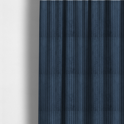The fabric used to create these made-to-measure curtains is a deep navy blue corduroy featuring a consistent vertical ribbed texture.