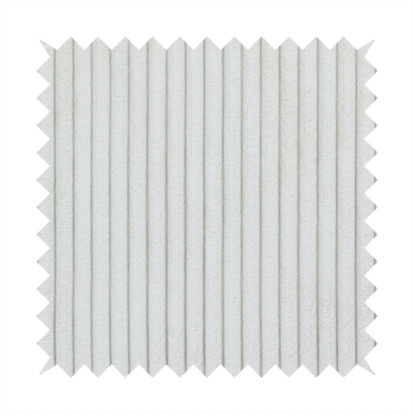 This fabric is a light grey corduroy featuring a consistent vertical ribbed texture.
