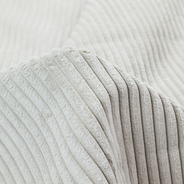 This fabric is a light grey corduroy featuring a consistent vertical ribbed texture.