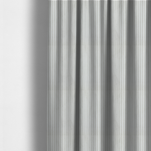 The fabric used to create these made-to-measure curtains is a light grey corduroy featuring a consistent vertical ribbed texture.