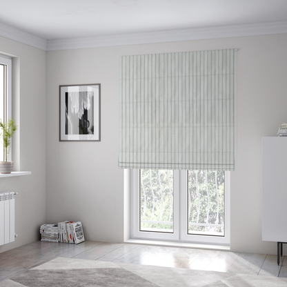 The fabric used to create these Roman blinds is a light grey corduroy featuring a consistent vertical ribbed texture.