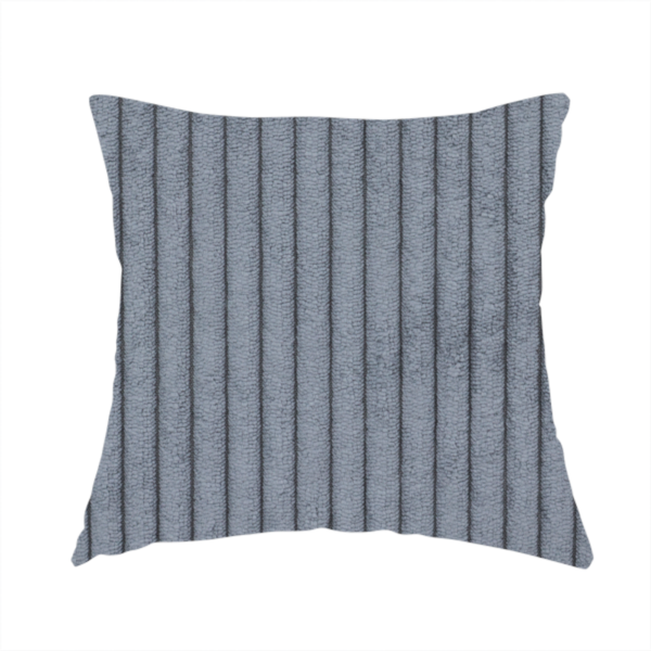 The fabric used to create this handmade cushion is a medium-to-dark grey corduroy featuring a consistent vertical ribbed texture.