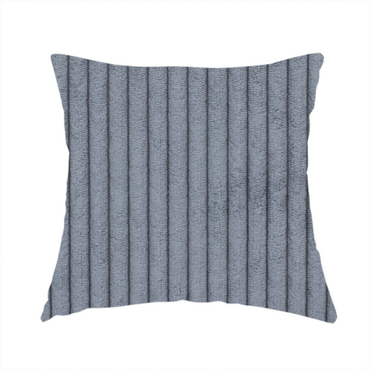 The fabric used to create this handmade cushion is a medium-to-dark grey corduroy featuring a consistent vertical ribbed texture.