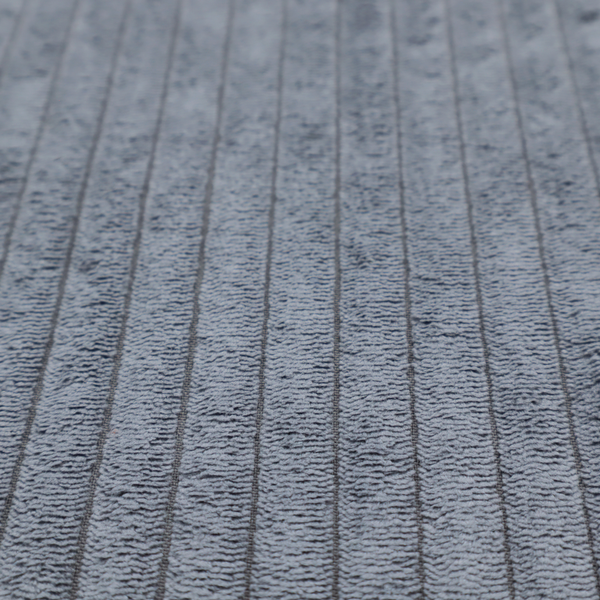 This fabric is a medium-to-dark grey corduroy featuring a consistent vertical ribbed texture.
