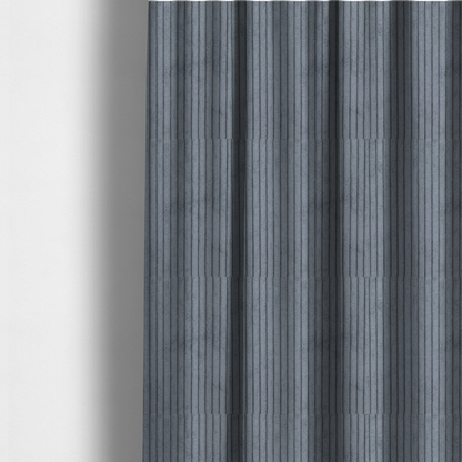 The fabric used to create these made-to-measure curtains is a medium-to-dark grey corduroy featuring a consistent vertical ribbed texture.