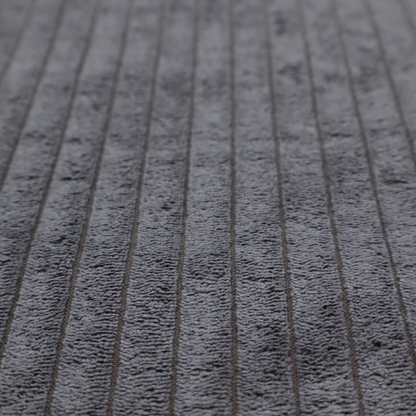 This fabric is a dark, cool-toned charcoal or slate-grey corduroy featuring a consistent vertical ribbed texture.