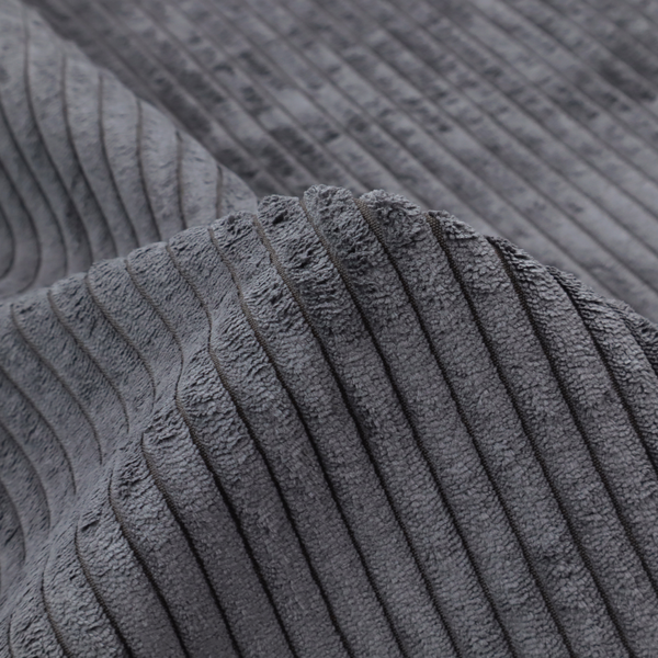 This fabric is a dark, cool-toned charcoal or slate-grey corduroy featuring a consistent vertical ribbed texture.