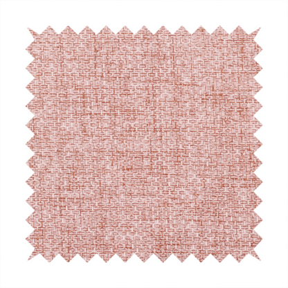 A tightly woven fabric in a dusty rose or muted terracotta colour, featuring a textured basket-weave pattern.