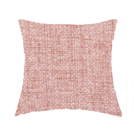 The fabric used to create this handmade cushion is a tightly woven fabric in a dusty rose or muted terracotta colour, featuring a textured basket-weave pattern.