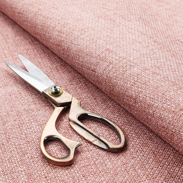 A tightly woven fabric in a dusty rose or muted terracotta colour, featuring a textured basket-weave pattern.