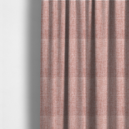 The fabric used to create these made-to-measure curtains is a tightly woven fabric in a dusty rose or muted terracotta colour, featuring a textured basket-weave pattern.