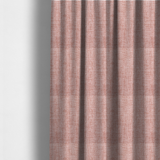 The fabric used to create these made-to-measure curtains is a tightly woven fabric in a dusty rose or muted terracotta colour, featuring a textured basket-weave pattern.