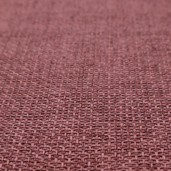 A tightly woven fabric in a deep, muted berry or dusky plum shade, featuring a distinct, structured basket-weave pattern.
