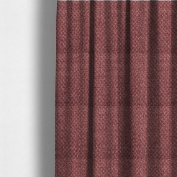 The fabric used to create these made-to-measure curtains is a tightly woven fabric in a deep, muted berry or dusky plum shade, featuring a distinct, structured basket-weave pattern.