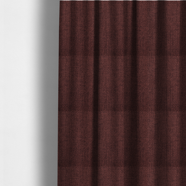 The fabric used to create these made-to-measure curtains is a tightly woven fabric in a deep, rich burgundy or dark maroon shade, featuring a distinct, structured basket-weave pattern.