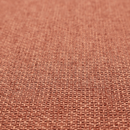 A tightly woven fabric in a warm, muted copper or terracotta shade, featuring a distinct, structured basket-weave pattern.
