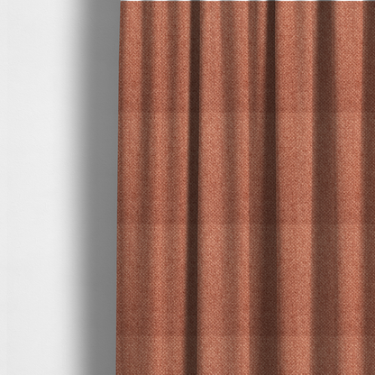 The fabric used to create these made-to-measure curtains is a tightly woven fabric in a warm, muted copper or terracotta shade, featuring a distinct, structured basket-weave pattern.