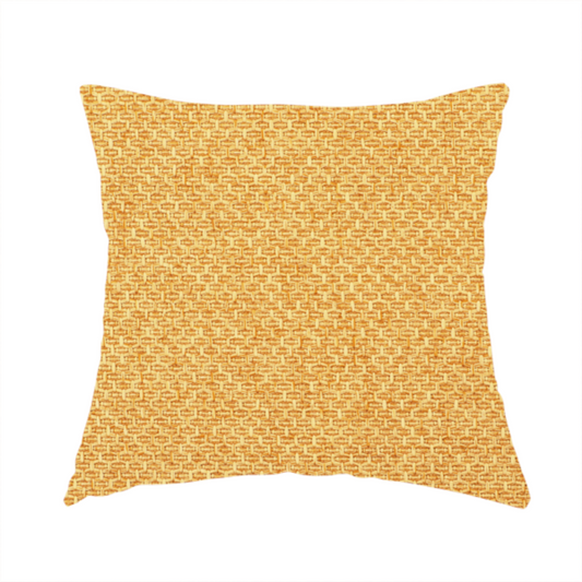 The fabric used to create this handmade cushion is a tightly woven fabric in a vibrant, warm golden-yellow shade, featuring a distinct, structured basket-weave pattern.