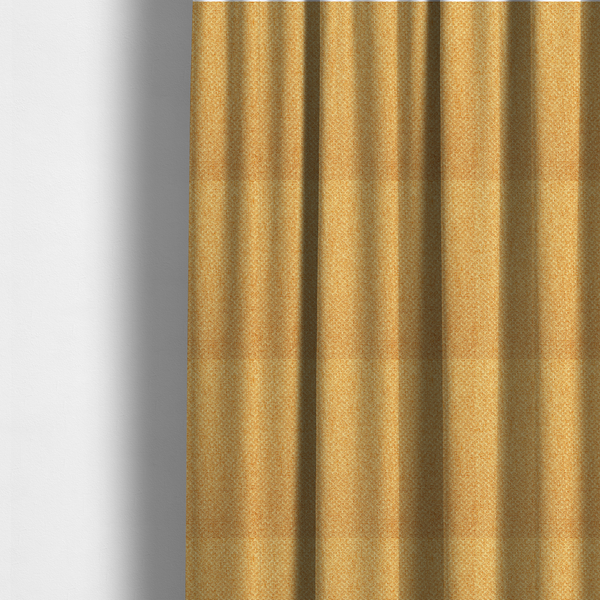 the fabric used to create these made-to-measure curtains is a tightly woven fabric in a vibrant, warm golden-yellow shade, featuring a distinct, structured basket-weave pattern.