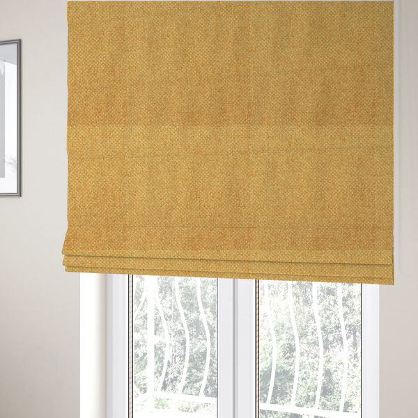 The fabric used to create these Roman blinds is a tightly woven fabric in a vibrant, warm golden-yellow shade, featuring a distinct, structured basket-weave pattern.