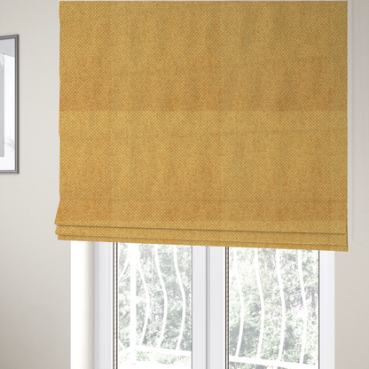 The fabric used to create these Roman blinds is a tightly woven fabric in a vibrant, warm golden-yellow shade, featuring a distinct, structured basket-weave pattern.
