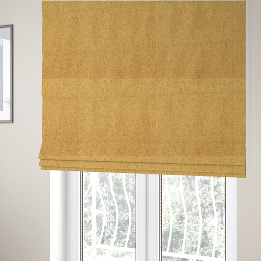 The fabric used to create these Roman blinds is a tightly woven fabric in a vibrant, warm golden-yellow shade, featuring a distinct, structured basket-weave pattern.
