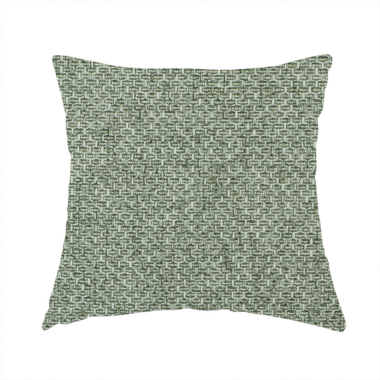 The fabric used to create this handmade cushion is a tightly woven fabric in a muted, earthy sage green shade, featuring a distinct, structured basket-weave pattern.
