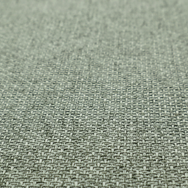 A tightly woven fabric in a muted, earthy sage green shade, featuring a distinct, structured basket-weave pattern.