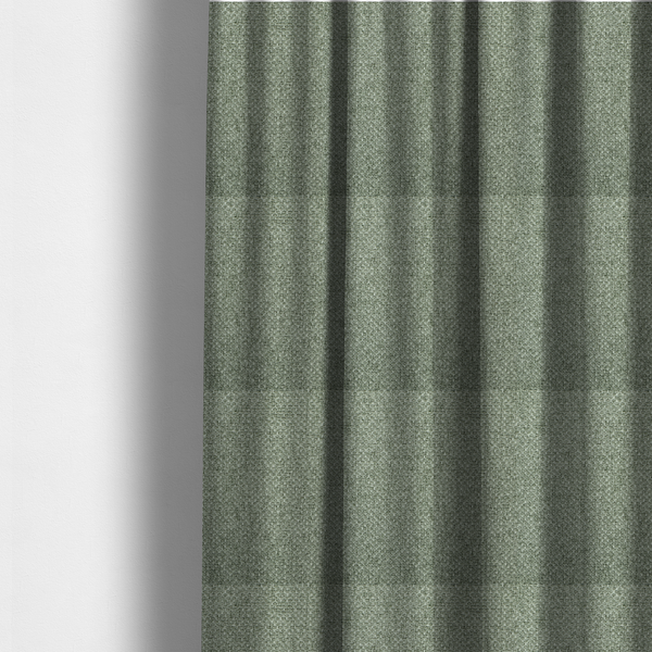 The fabric used to create these made-to-measure curtains is a tightly woven fabric in a muted, earthy sage green shade, featuring a distinct, structured basket-weave pattern.