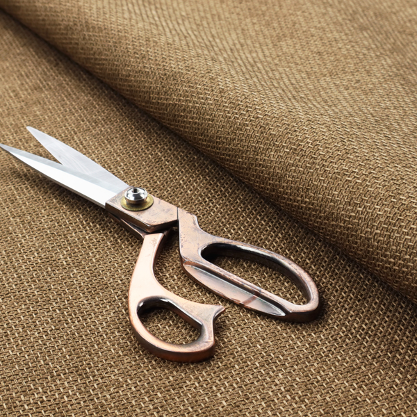 A tightly woven fabric in a neutral, earthy khaki shade, featuring a distinct, structured basket-weave pattern.